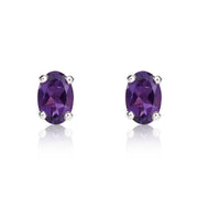 9ct White Gold Amethyst 6x4mm Oval Claw Set Stud Earrings. 33-51-035.